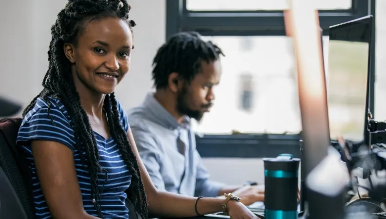 A woman working at a computer in Kenya